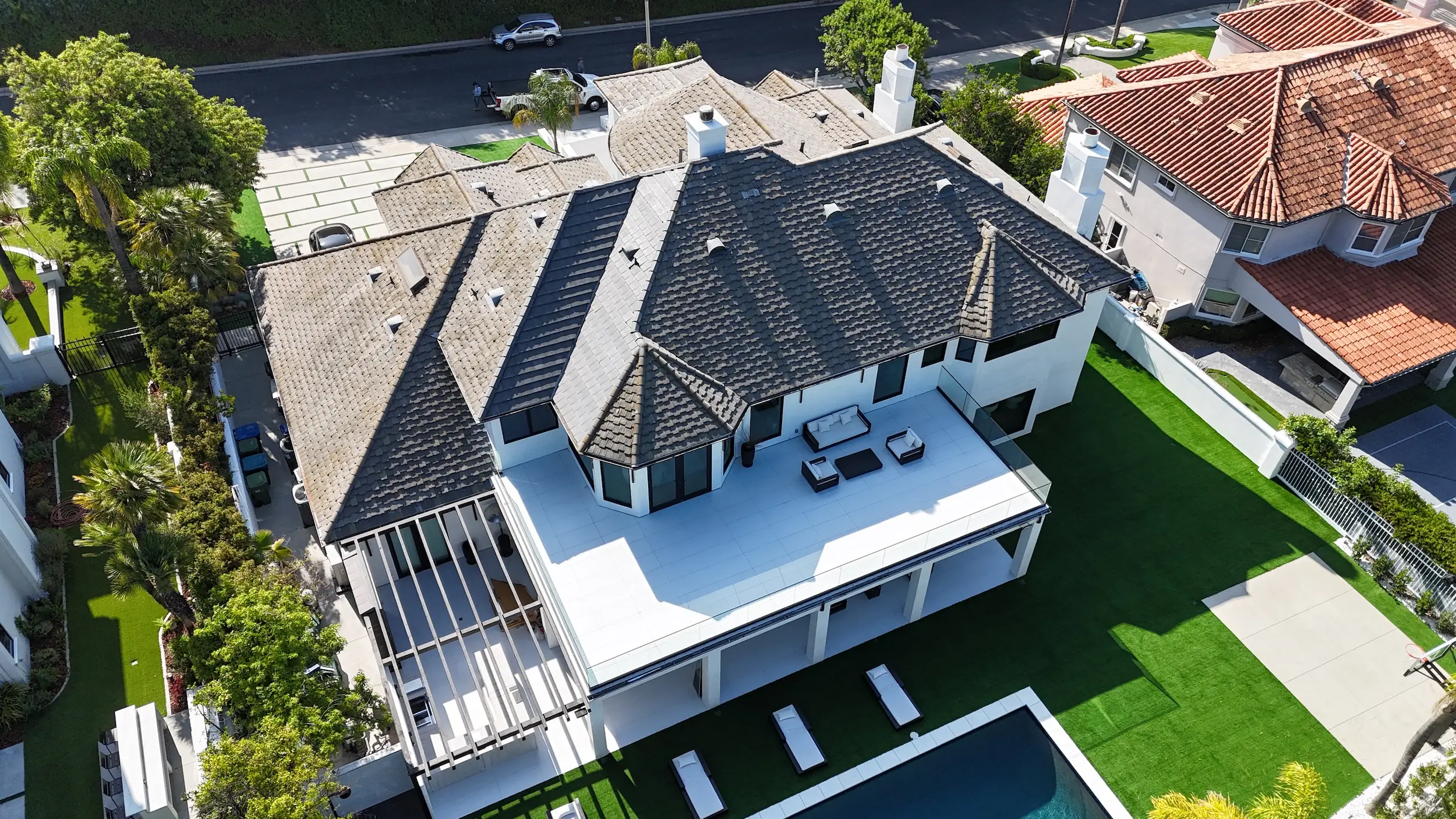 Re-roof with flat-deck tie-in by White Palm Roofing